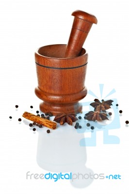 Wooden Mortar And Pestle With Spices Ready For Grinding Stock Photo