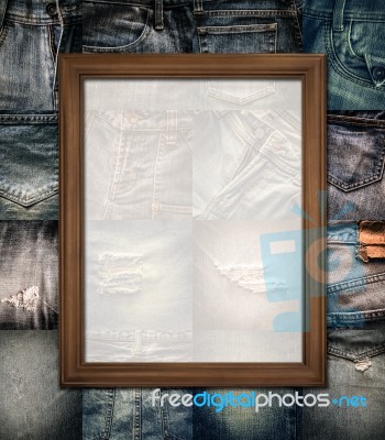 Wooden Picture Frame On Collage Jeans Stock Photo