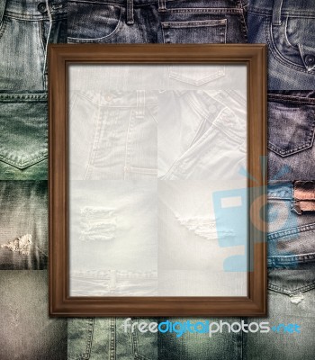 Wooden Picture Frame On Collage Jeans Stock Photo