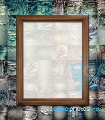 Wooden Picture Frame On Collage Jeans Stock Photo