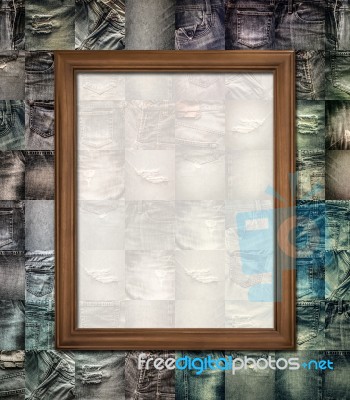 Wooden Picture Frame On Collage Jeans Stock Photo