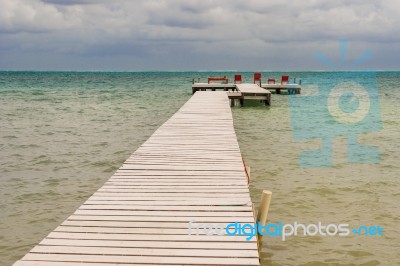 Wooden Pier Dock And Ocean View At Caye Caulker Belize Caribbean… Stock Photo