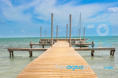 Wooden Pier Dock And Ocean View At Caye Caulker Belize Caribbean… Stock Photo