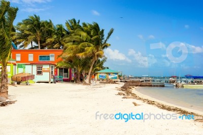 Wooden Pier Dock, Boats And Ocean View At Caye Caulker Belize Ca… Stock Photo