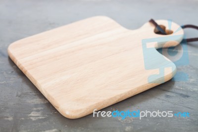 Wooden Plate On Gray Background Stock Photo