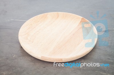 Wooden Plate On Grey Background Stock Photo