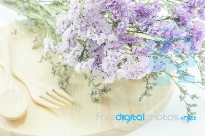 Wooden Set Of Food Utensil And Static Flower Stock Photo