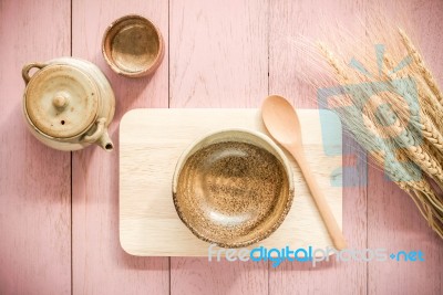 Wooden Spoon And Dish With Asian Teapot And Tea Cup On Wooden Background Stock Photo