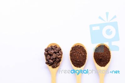 Wooden Spoons Filled With Coffee Bean And Crushed Ground Coffee Stock Photo