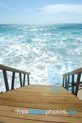 Wooden Stairs Or Path To The Bright Ocean Stock Photo