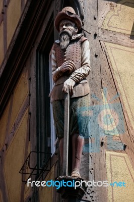 Wooden Statue Of A Man In Colmar Stock Photo