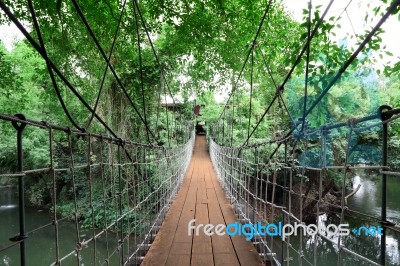 Wooden Suspension Bridge Cross Small River To House Stock Photo