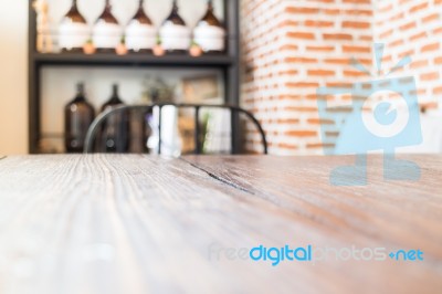 Wooden Table And Bottle Of Essential Oil Stock Photo