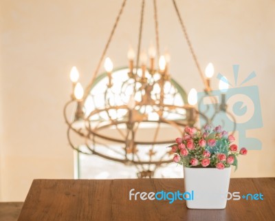 Wooden Table Decorated With Flower Bouquet Stock Photo