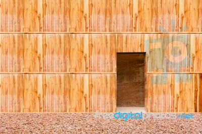 Wooden Wall With Door And Stone Floor In Front Off Stock Photo