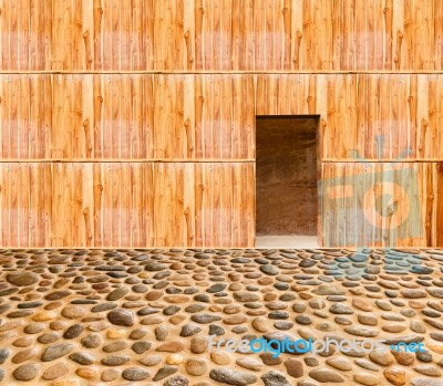 Wooden Wall With Door And Stone Floor In Front Off Stock Photo