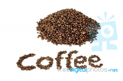 Word Coffee With Heap Of Coffee Beans Stock Photo