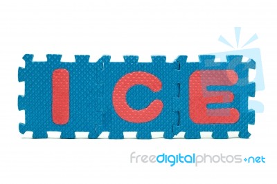 Word Ice Formed With Colorful Foam Puzzle Mat Isolated On White Stock Photo