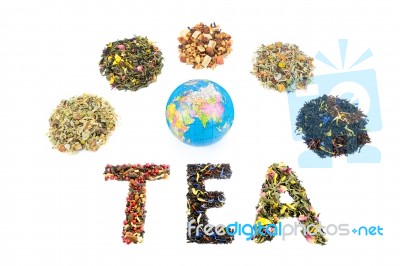 Word Tea With Globe And Various Heaps Of Tea Species Stock Photo