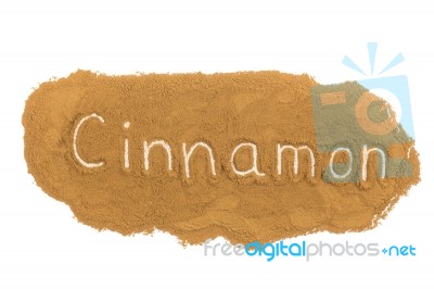 Word Written In Cinnamon Powder On White Background Stock Photo