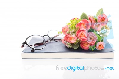 Work Space With Notebook,glasses And Rose Bouquet Isolated On Wh… Stock Photo