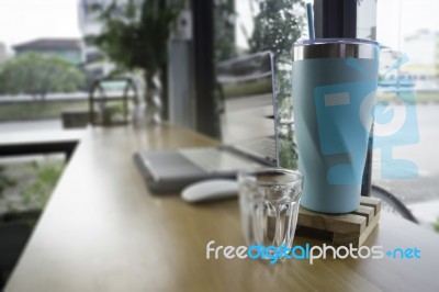 Work Table With Laptop And Drink Stock Photo