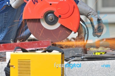 Worker Cutting Steel Tool Stock Photo