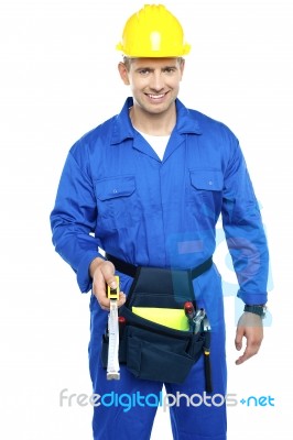 Worker Holding Measuring Tape Stock Photo