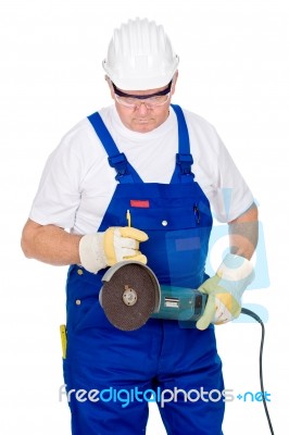 Worker Holding Surface Grinding Machine Stock Photo