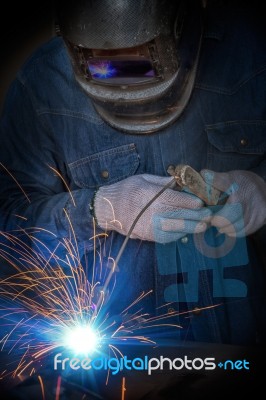 Worker Welding Stock Photo