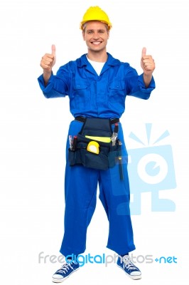 Worker With Thumbs Up Gesture Stock Photo