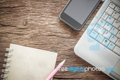 Working Space. Laptop, Notebook, Smartphone On Wooden Desk. Business Concept Stock Photo