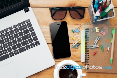 Workplace With Laptop Coffee Phone And Notebook On Wood Desk Stock Photo