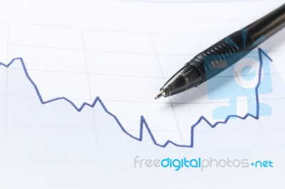 Workplace With Pen, Notebook, Financial Report Stock Photo