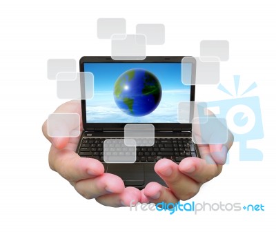 World And Laptop PC On Hand Stock Photo