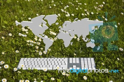 World Map And Keyboard On Garden Stock Image