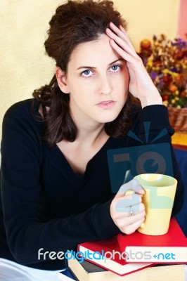 Worried Student And Bunch Of Books At Home Stock Photo