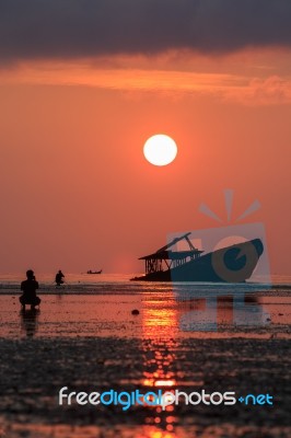 Wreck Boat ,sun Rising Sky And Photographer At Phuket Thailand Stock Photo