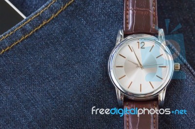 Wristwatch On Denim Jeans Pocket Stock Photo