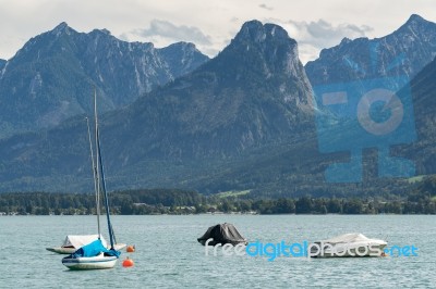 Yachts Moored In Lake Wolfgang At St. Gilgen Stock Photo