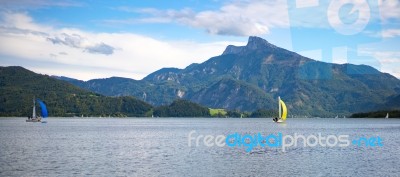 Yachts Sailing On Lake Mondsee In Austria Stock Photo