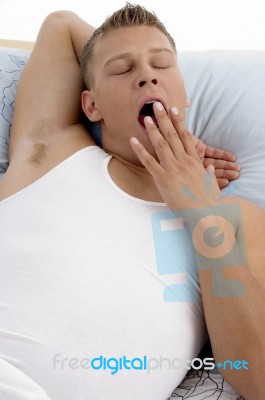 Yawning Young Man Stock Photo