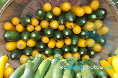 Yellow And Green Zucchini In Basket Stock Photo