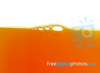 Yellow Bubbles In The Orange Juice Stock Photo