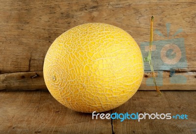 Yellow Cantaloupe Melon On The Wooden Background Stock Photo