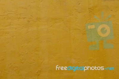 Yellow Cement Wall Stock Photo