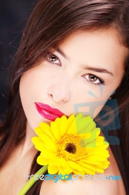 Yellow Daisy On Woman's Shoulder Stock Photo