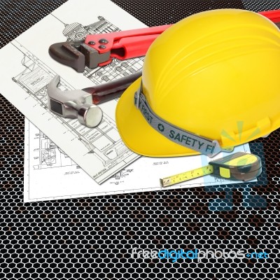 Yellow Hard Hat On Blueprint Stock Photo