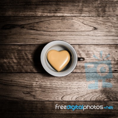 Yellow Heart Ceramic In Coffee Cup Stock Photo