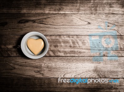 Yellow Heart Ceramic In Coffee Cup Stock Photo